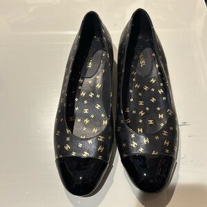 Authentic Chanel black low heel with gold detail
